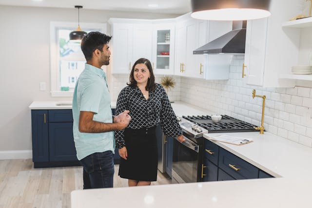 two people looking at an oven